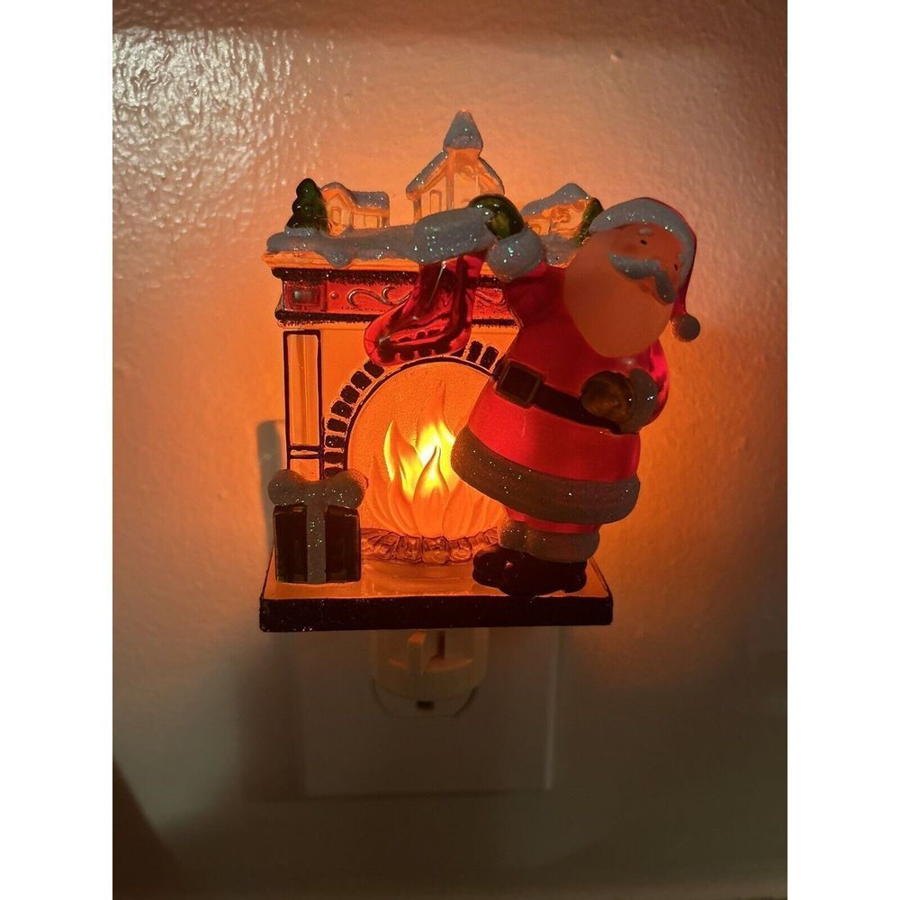 Santa Claus Hanging Stockings On The Fireplace Mantle Flickering Night Light - Picture 1 of 3